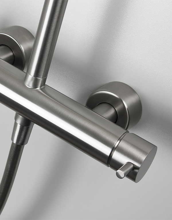 Detail of shower column with sliding rail stainless steel inox 316L, pulling diverter with automatic return, hand shower with l. 160cm flexible tube and inspectionable shower head Ø20cm, finish 022 - brushed